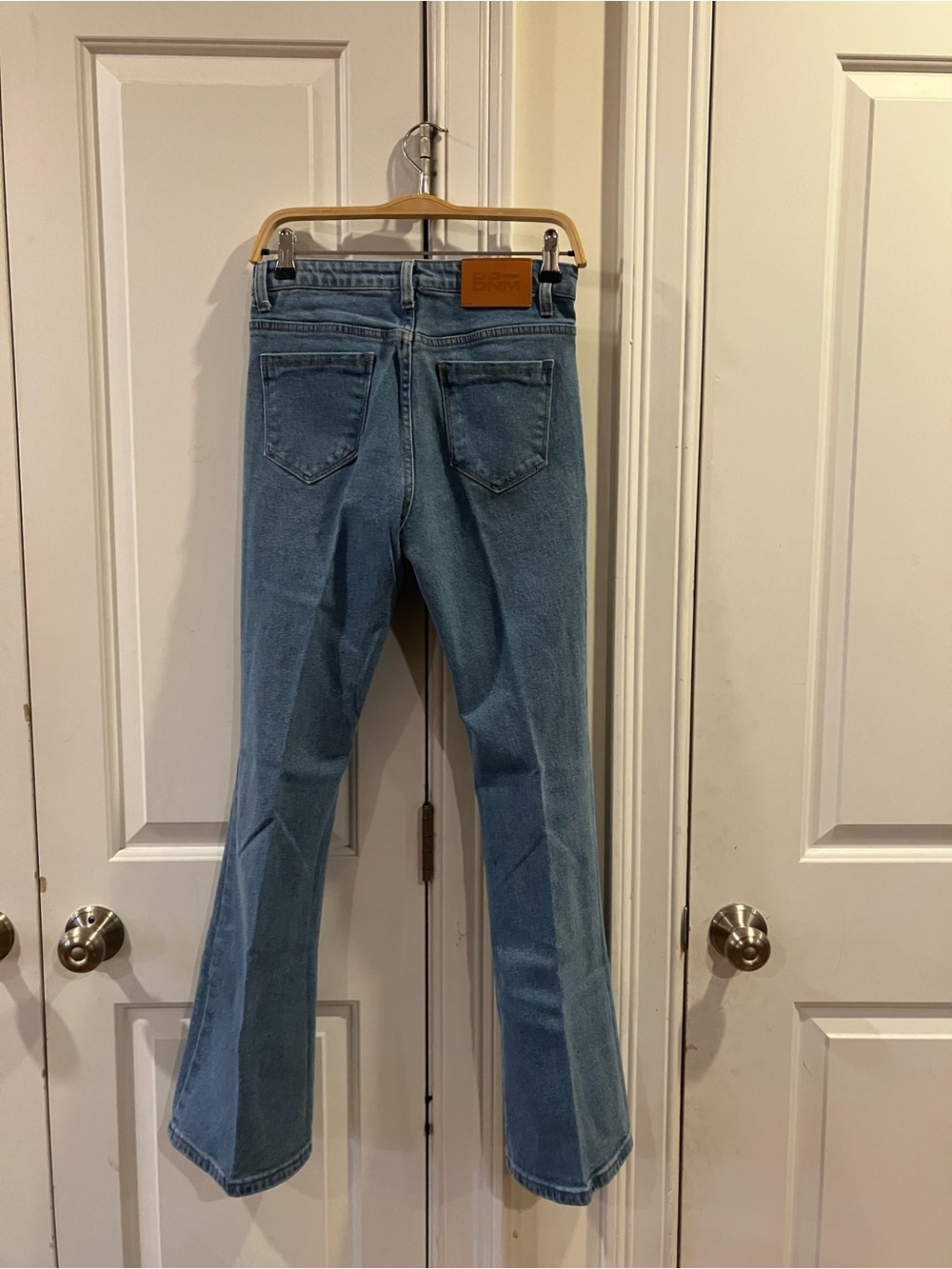 NYDJ Light Wash Flare Jeans — Classic Back-Patch Detail